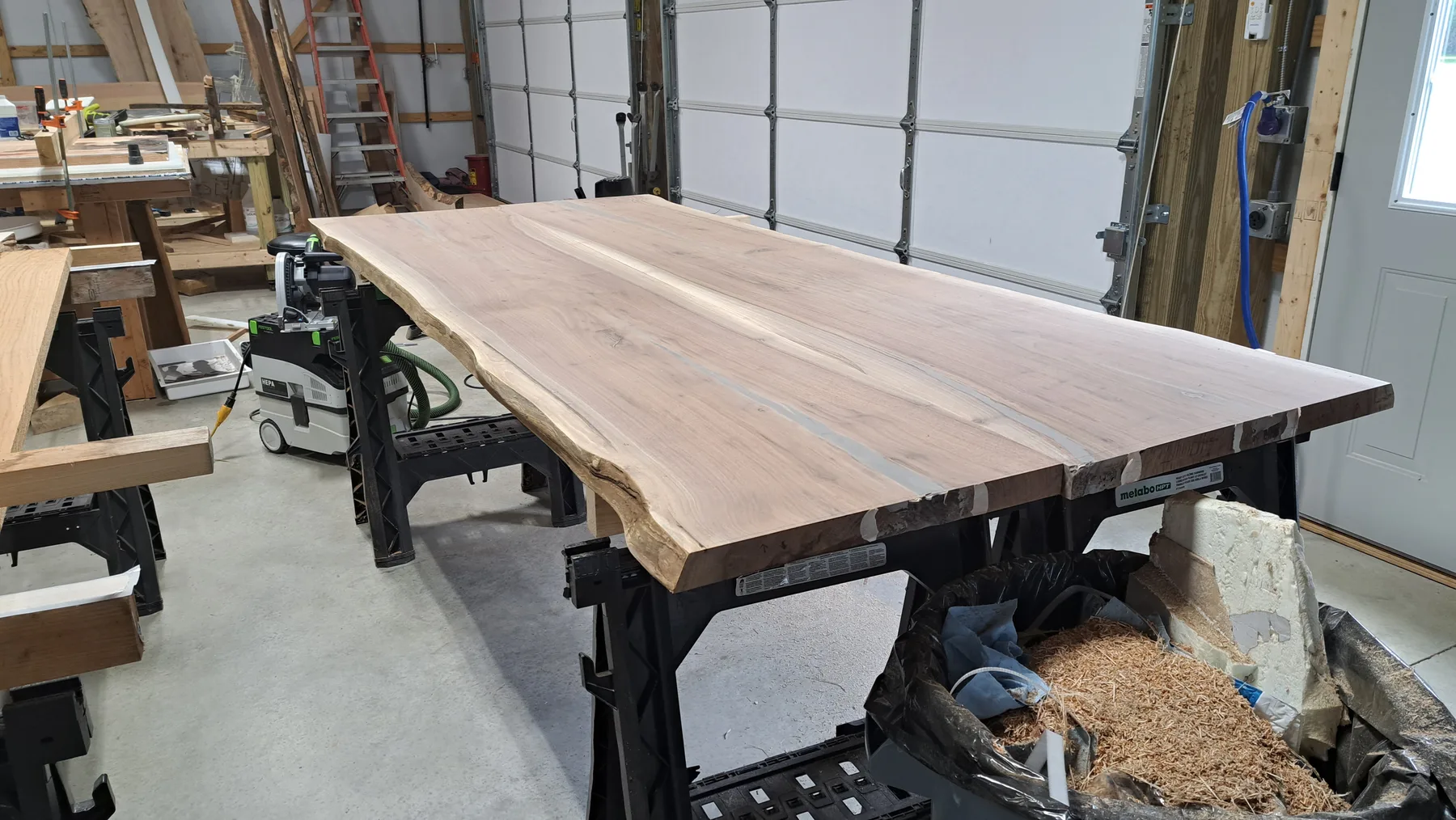 family walnut table from their tree behind the build photo 8
