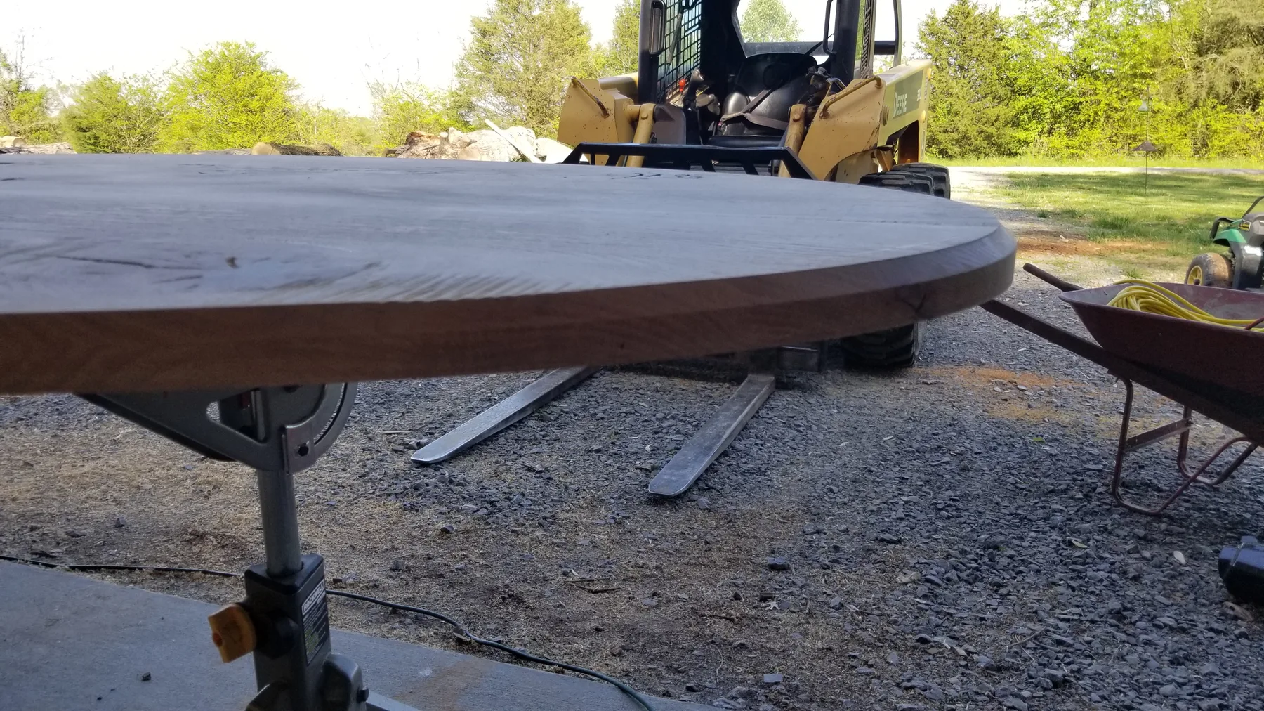White oak oval dining table behind the build photo 2