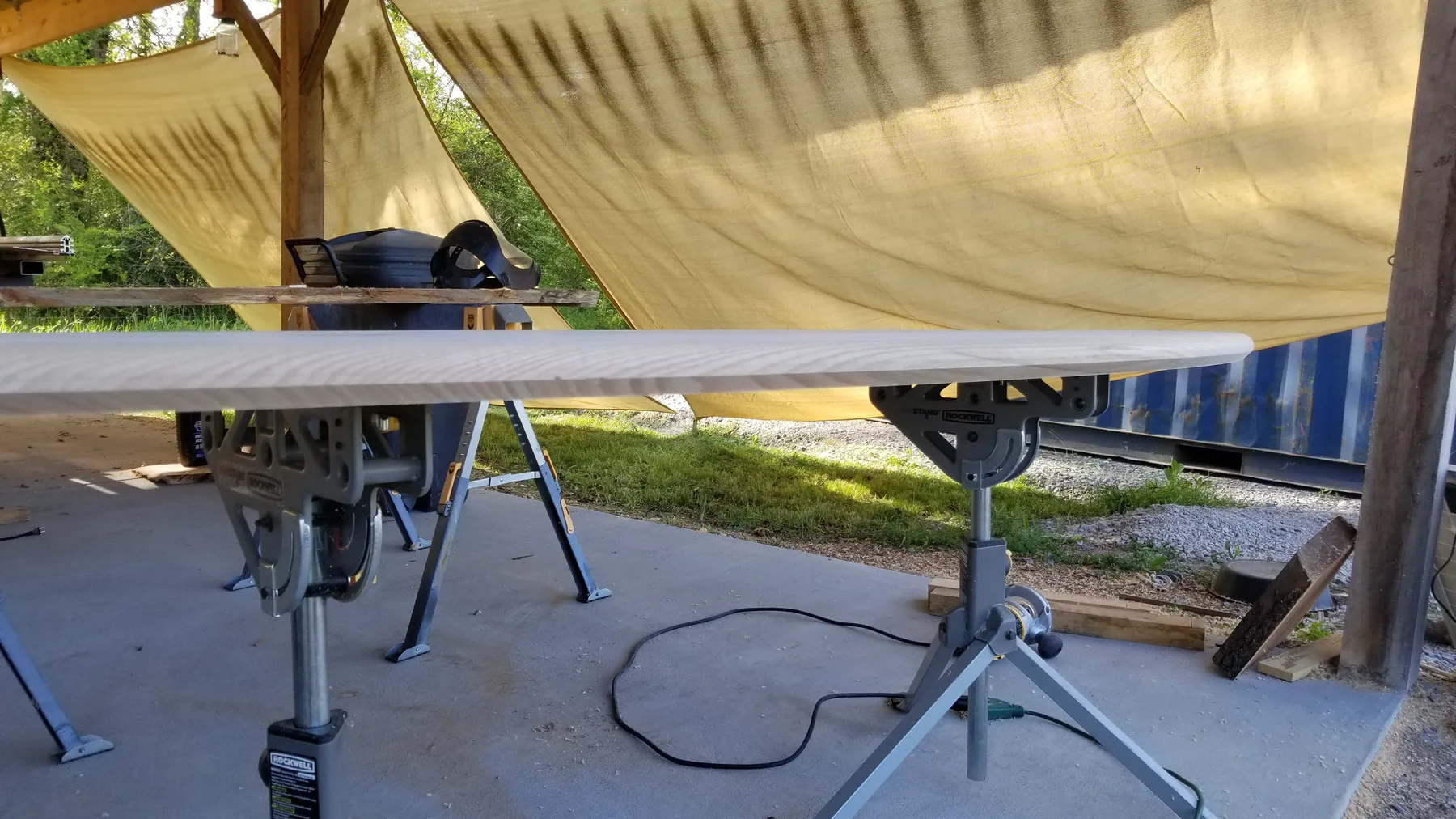 White oak oval dining table behind the build photo 3