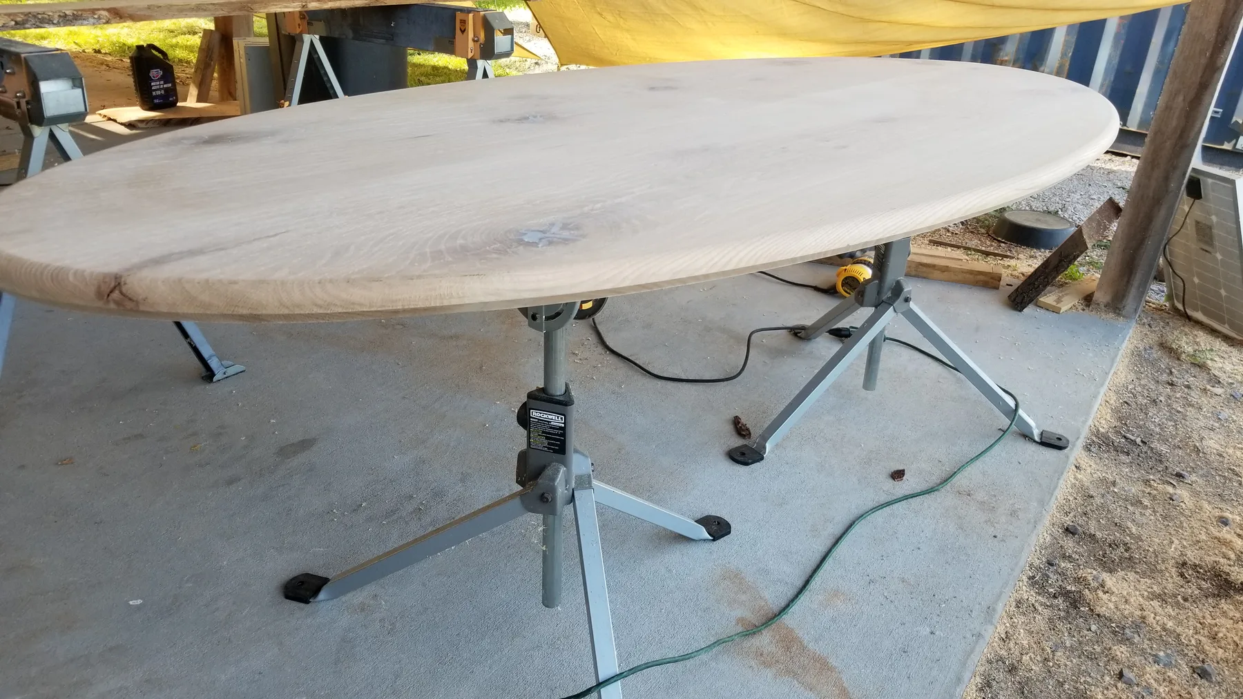 White oak oval dining table behind the build photo 6