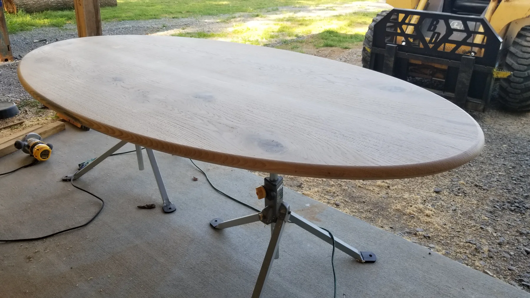White oak oval dining table behind the build photo 8